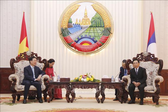 Lãnh đạo cấp cao Đảng, Nhà nước Lào tiếp đoàn đại biểu cấp cao Đảng, Nhà nước ta - Ảnh 2.