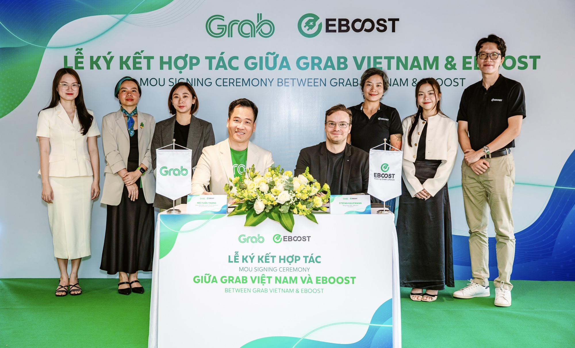 Grab hợp tác EBOOST mở rộng sử dụng xe điện tại Việt Nam- Ảnh 1.