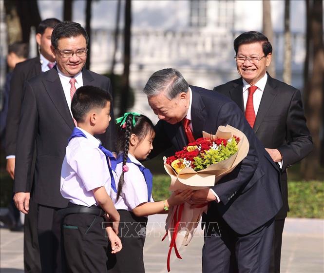 Lễ đón trọng thể Tổng Bí thư Tô Lâm tại thủ đô Viêng Chăn (Lào)- Ảnh 1.