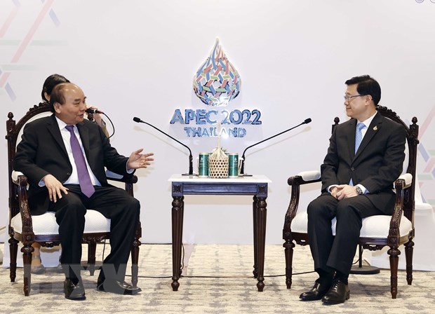 President meets Hong Kong, IMF officials on sidelines of APEC  - Ảnh 1.