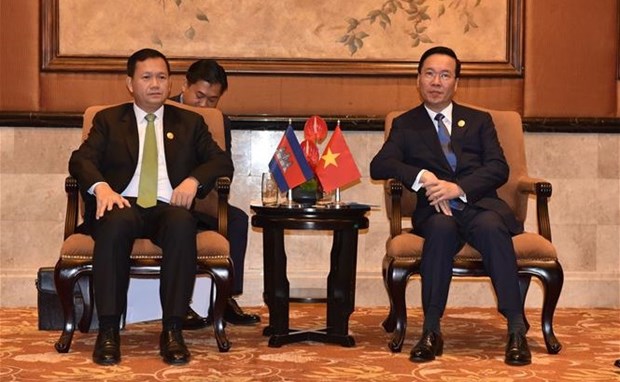 President meets Uzbek counterpart, Cambodian PM in Beijing  - Ảnh 3.