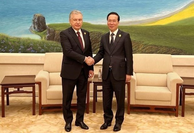 President meets Uzbek counterpart, Cambodian PM in Beijing  - Ảnh 1.
