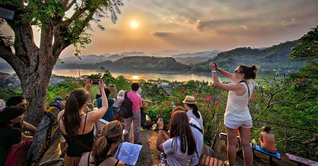 Viet Nam becomes second largest tourism market of Laos in H1 - Ảnh 1.