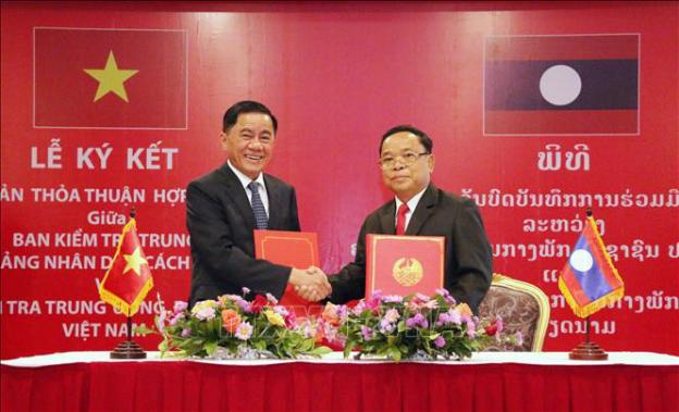 越共中央检查委员会主任陈锦秀访问老挝 - Ảnh 1.