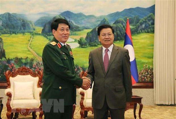 越共政治局委员、越南人民军队政治部主任梁强访问老挝 - Ảnh 1.