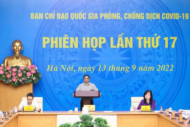 越南政府总理范明正主持召开国家新冠肺炎疫情防控指导委员会会议 - Ảnh 1.