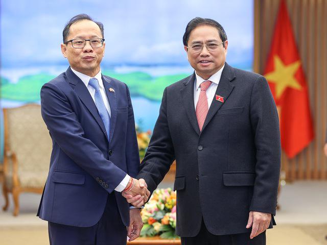 越南政府总理范明正会见柬埔寨驻越大使 - Ảnh 1.