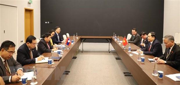 越南国会常务副主席分别会见各国议会联盟领导和老挝国会领导 - Ảnh 2.
