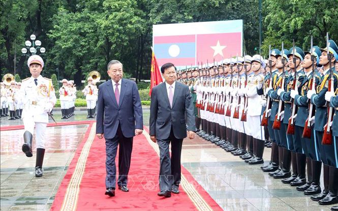 苏林总书记、国家主席举行迎接仪式，欢迎老挝人民革命党总书记、国家主席对越南进行国事访问