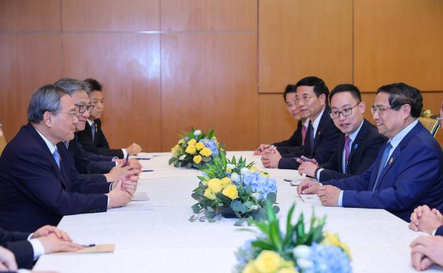 越南政府总理范明正会见中国国务院总理李强- Ảnh 2.