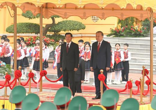 苏林总书记主持仪式 欢迎老挝人民革命党中央总书记、国家主席通伦访越- Ảnh 1.