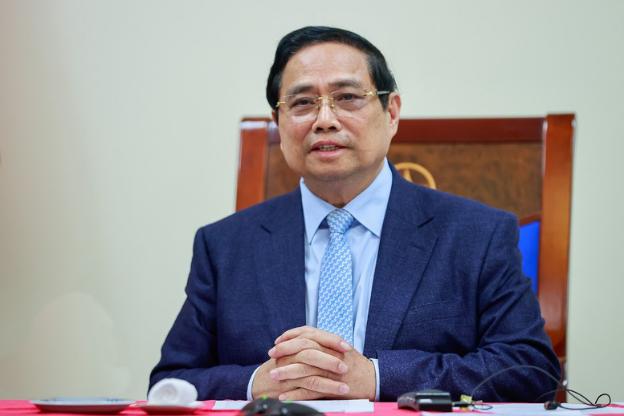 越南政府总理范明政与卡塔尔首相兼外交大臣通电话- Ảnh 1.