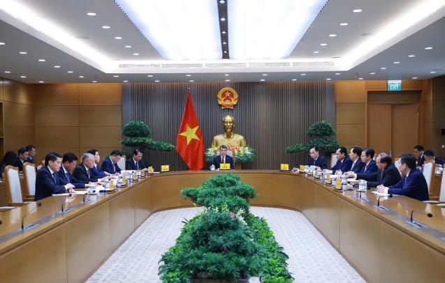 政府总理黎明兴同中国国务院总理李强通电话- Ảnh 2.