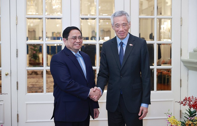 Chùm ảnh: Lễ đón Thủ tướng Phạm Minh Chính thăm chính thức Singapore - Ảnh 3.