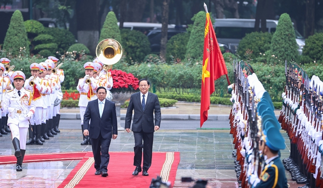 Chùm ảnh: Lễ đón trọng thể Thủ tướng Lào Sonexay Siphandone thăm chính thức Việt Nam- Ảnh 4.