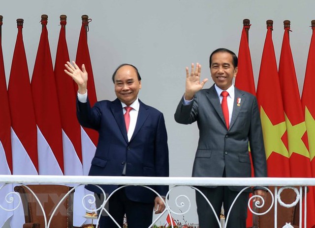 Indonesian President hosts welcome ceremony for President Nguyen Xuan Phuc - Ảnh 4.