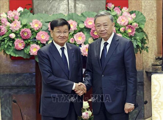 President To Lam meets with Lao Party General Secretary- Ảnh 1.