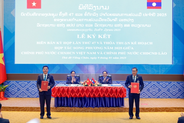 Viet Nam, Laos pledge to soon realize trade goal of US$5 billion- Ảnh 3.