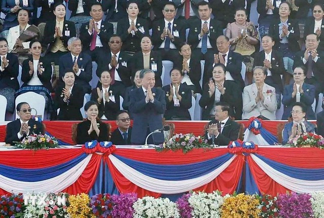 Party leader attends 50th anniversary of Laos National Day- Ảnh 1. Party leader attends 50th anniversary of Laos National Day- Ảnh 1.
