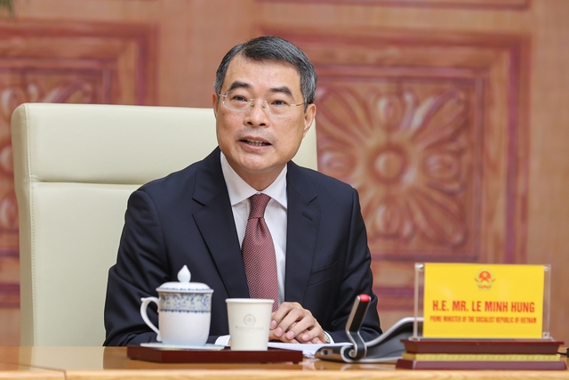 Prime Minister Le Minh Hung hosts reception for American business delegation- Ảnh 1.