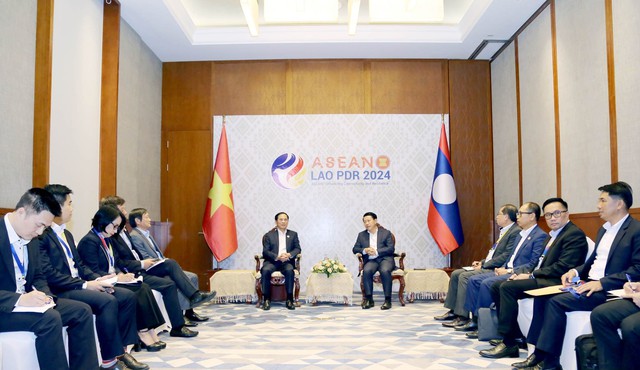 越南与柬埔寨协助老挝成功担任2024年东盟轮值主席国- Ảnh 1.
