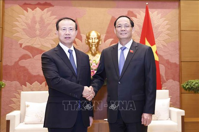 越南国会副主席陈光方会见中国全国人大外事委员会副主任委员傅自应- Ảnh 1.