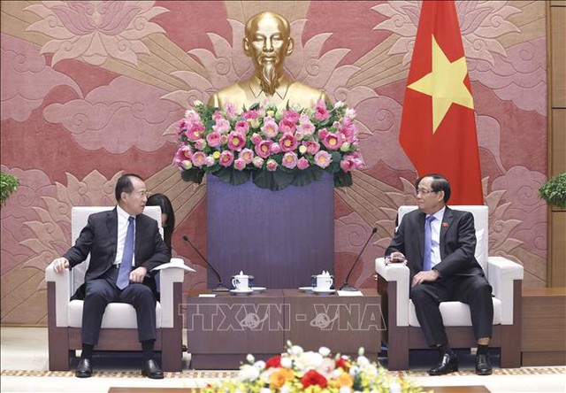 越南国会副主席陈光方会见中国全国人大外事委员会副主任委员傅自应- Ảnh 2.