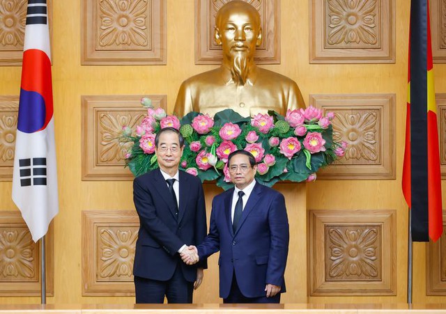 越南政府总理范明正会见韩国总理韩德洙- Ảnh 1.