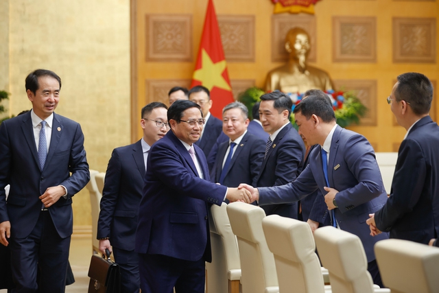 越南政府总理范明正：越中企业应以具体行动推动两国高层共识落地见效- Ảnh 1.