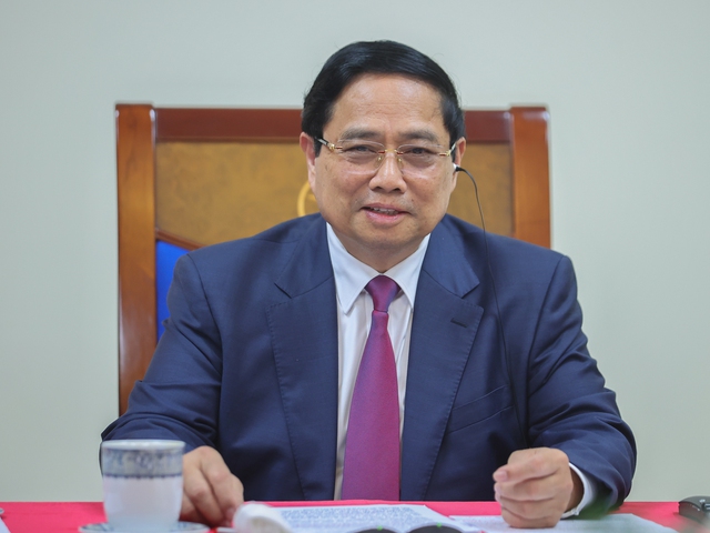 越南政府总理范明正与柬埔寨首相洪玛奈通电话- Ảnh 1.