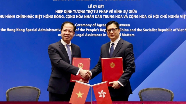 越南和中国香港签署刑事事宜相互法律协助协定- Ảnh 1.
