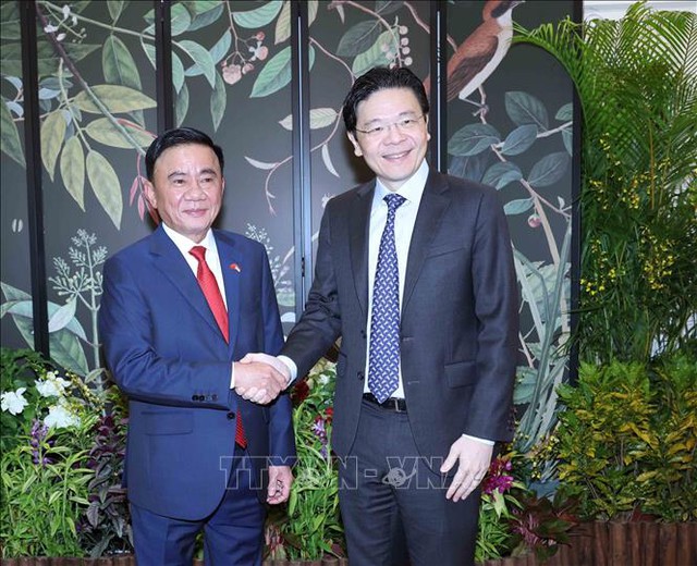 越共中央书记处常务书记陈锦绣会见新加坡人民行动党秘书长、政府总理黄循财- Ảnh 1.