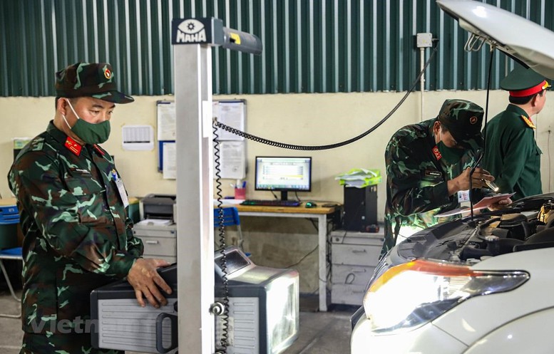 Đề nghị Bộ Quốc phòng tiếp tục hỗ trợ nhân lực các trung tâm đăng kiểm - Ảnh 1.