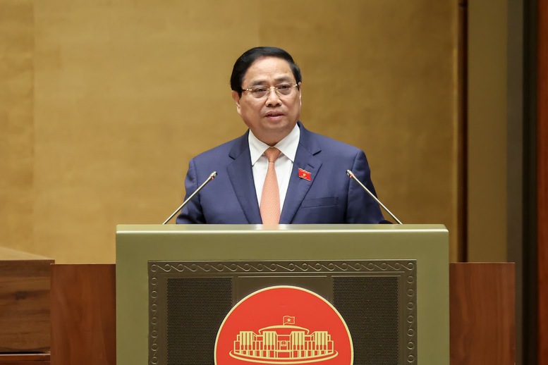 Thủ tướng Chính phủ Phạm Minh Chính trình bày Báo cáo tóm tắt kết quả thực hiện Kế hoạch phát triển kinh tế - xã hội năm 2025 và 5 năm 2021 - 2025; dự kiến kế hoạch phát triển kinh tế - xã hội năm 2026 - Ảnh: VGP/Nhật Bắc