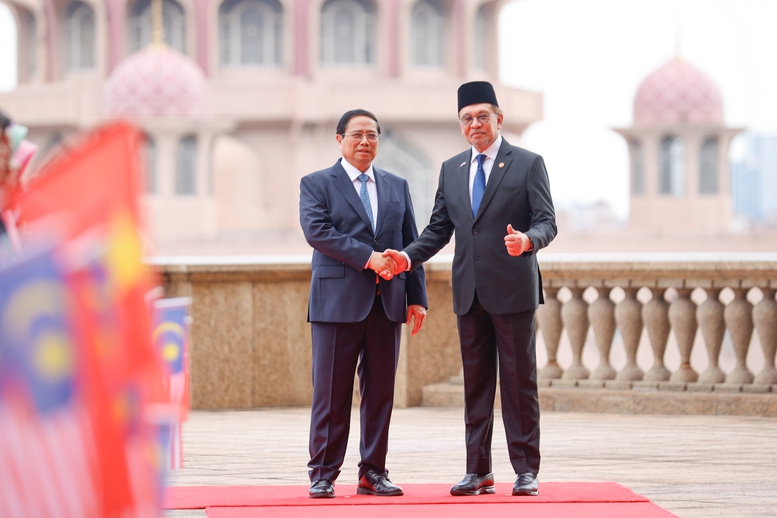 Thủ tướng Anwar Ibrahim chủ trì lễ đón Thủ tướng Phạm Minh Chính thăm chính thức Malaysia- Ảnh 10.