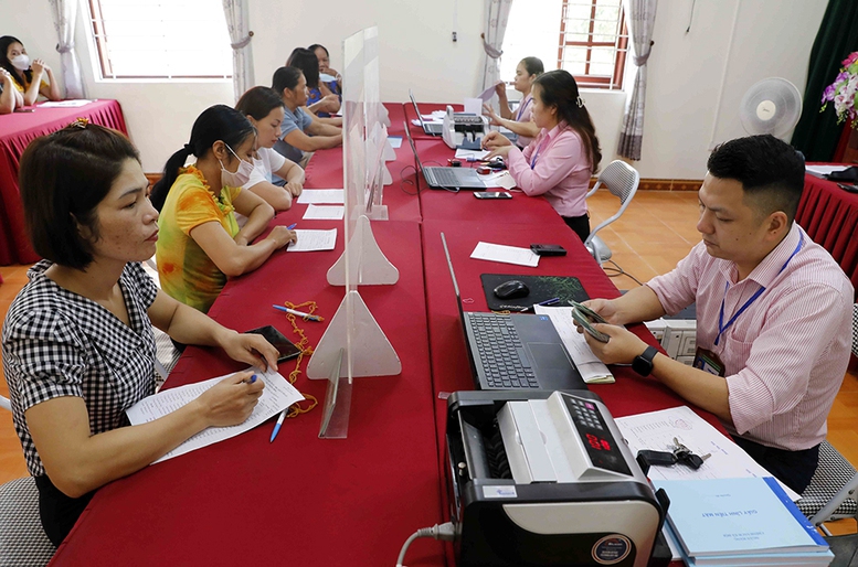 Tín dụng chính sách xã hội trơn tru, bon bon sau sáp nhập- Ảnh 1.