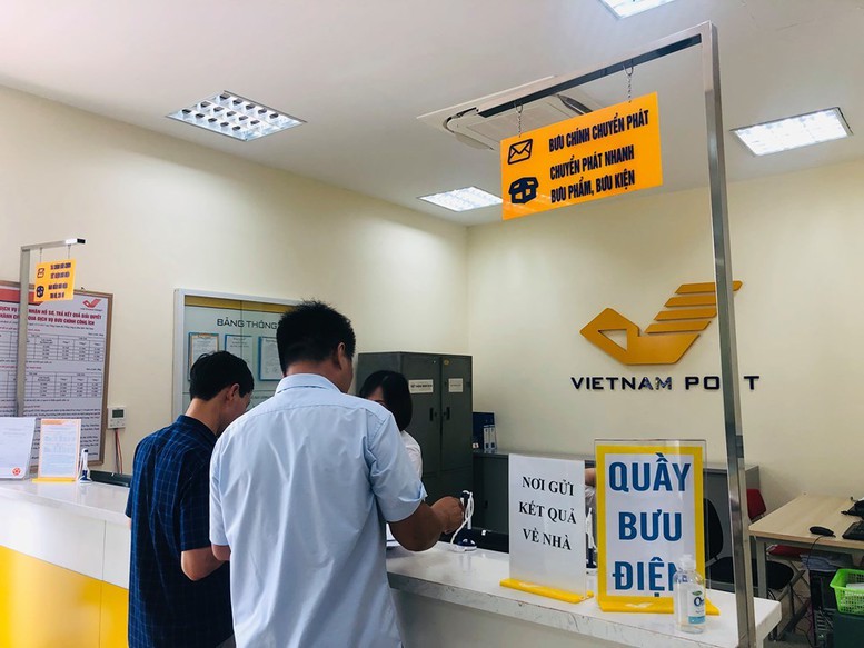Thí điểm triển khai dịch vụ công qua mạng bưu chính công cộng tại Hà Nội, Huế, Gia Lai- Ảnh 1.