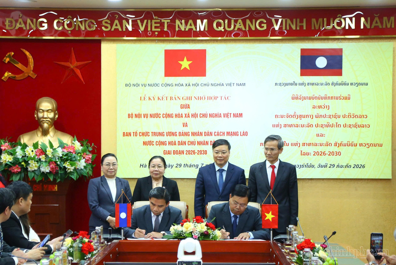 Bộ Nội vụ Việt Nam ký kết hợp tác với Ban Tổ chức Trung ương Đảng Nhân dân Cách mạng Lào- Ảnh 1.