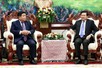 越老加强政治互信，深化经贸合作