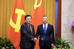 越中两党加强治党治国经验交流