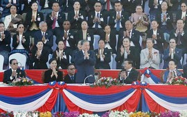 Party leader attends 50th anniversary of Laos National Day