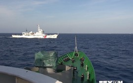 China deploys six military ships to protect illicit rig