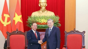 Party leader receives Lao Deputy PM