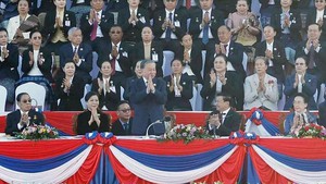 Party leader attends 50th anniversary of Laos National Day