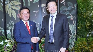 越共中央书记处常务书记陈锦绣会见新加坡人民行动党秘书长、政府总理黄循财